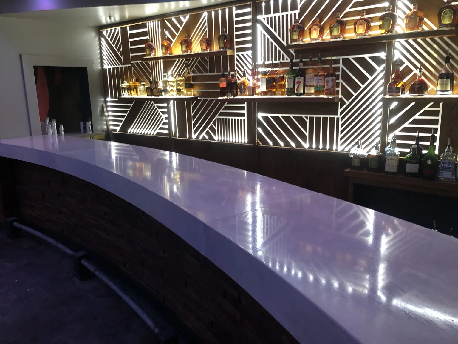 Long white commercial concrete bar top