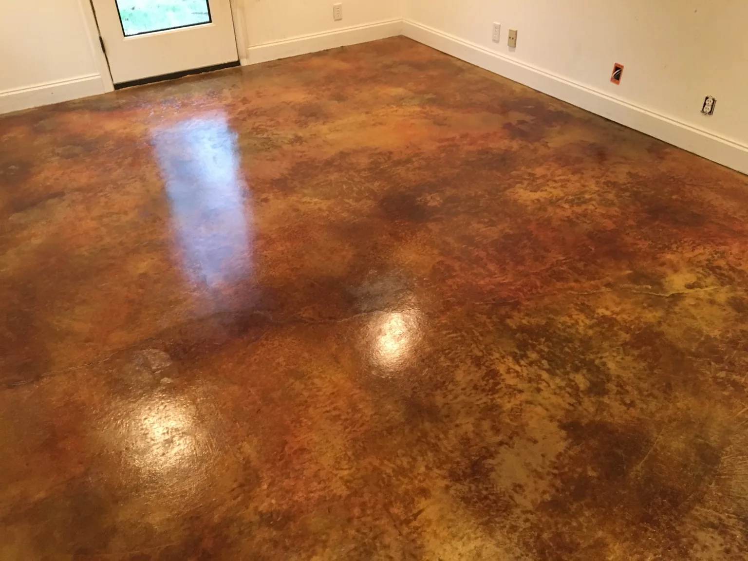 Copper-brown stained concrete floor